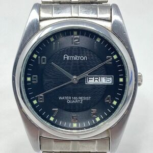 Armitron Mens Watch 31mm Silver Tone Day Date Stretch Band WR 50M New Battery 7"